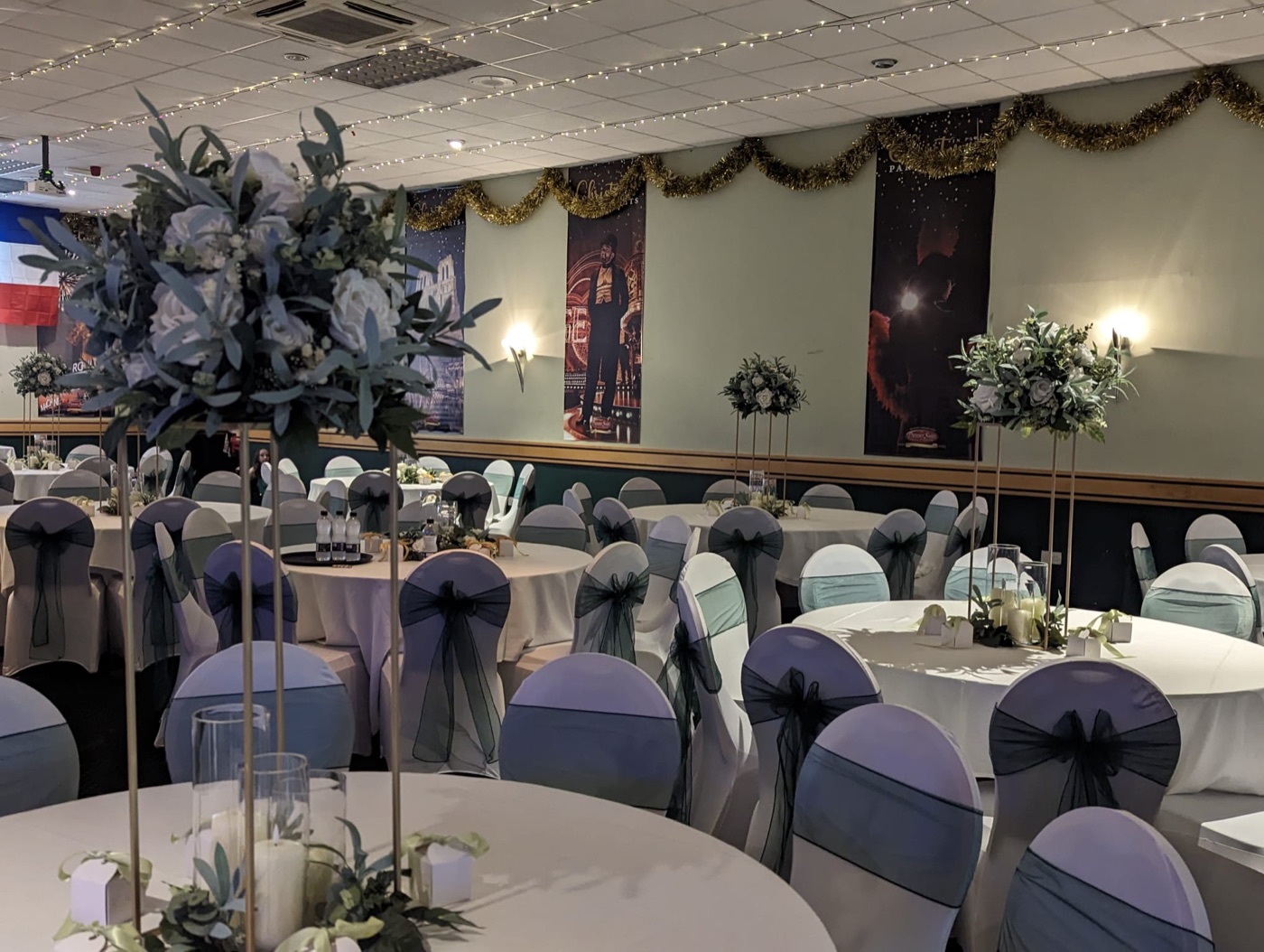 The suite dressed for a wedding with floral centrepieces and chair sashes